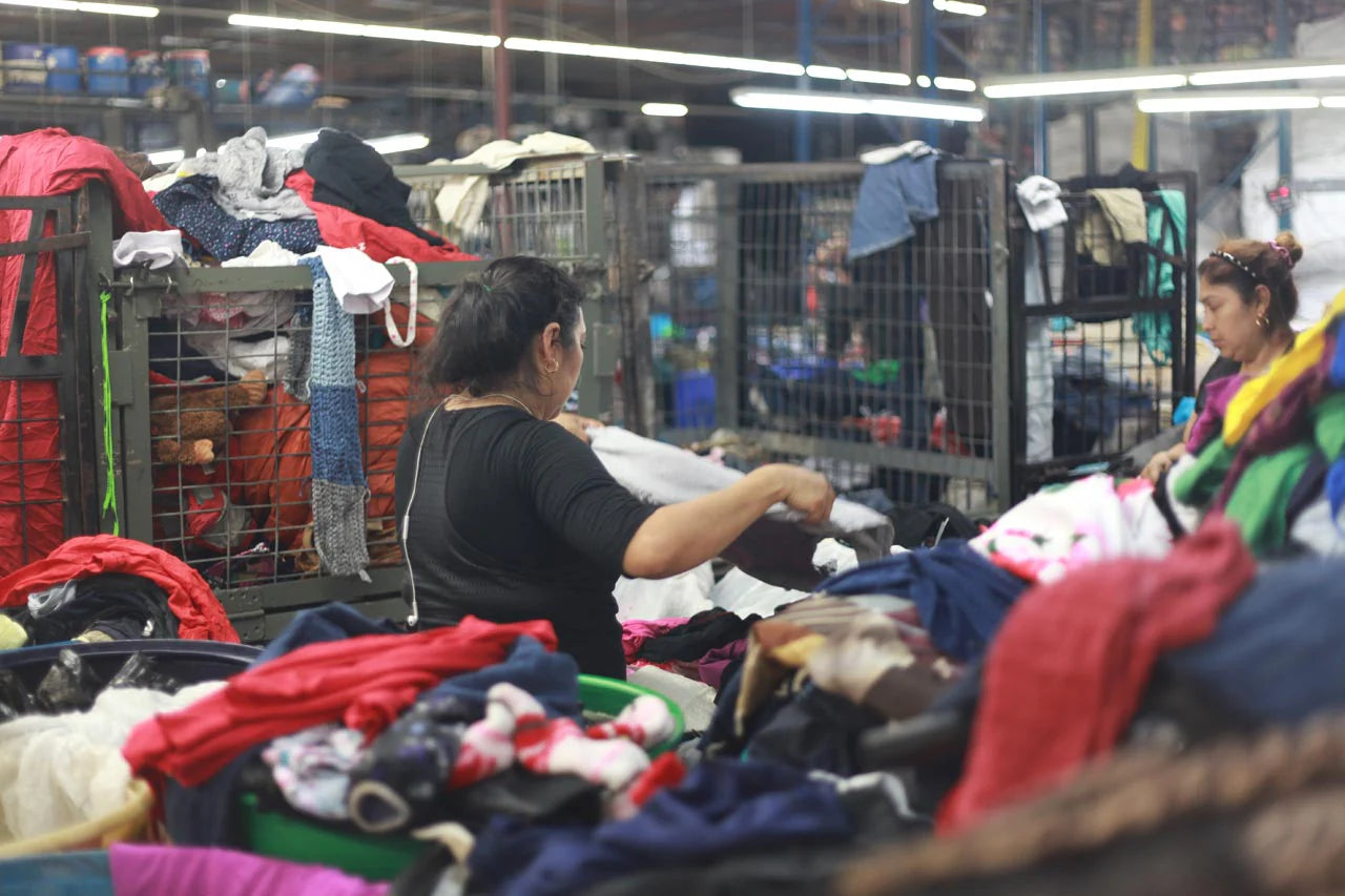 Workers sorting clothes in a garment factory.